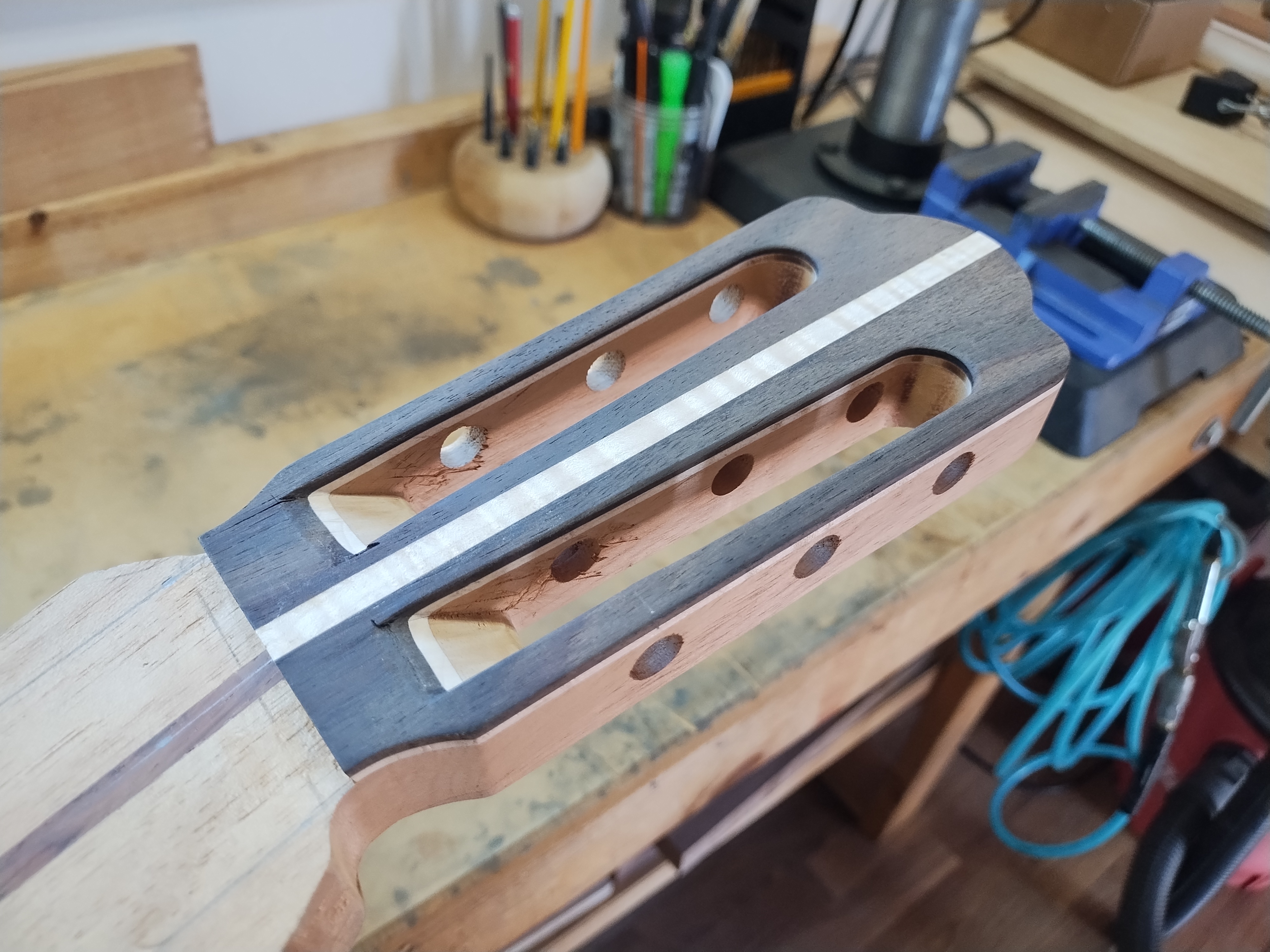 Classical guitar headplate processed and shaped in the workshop