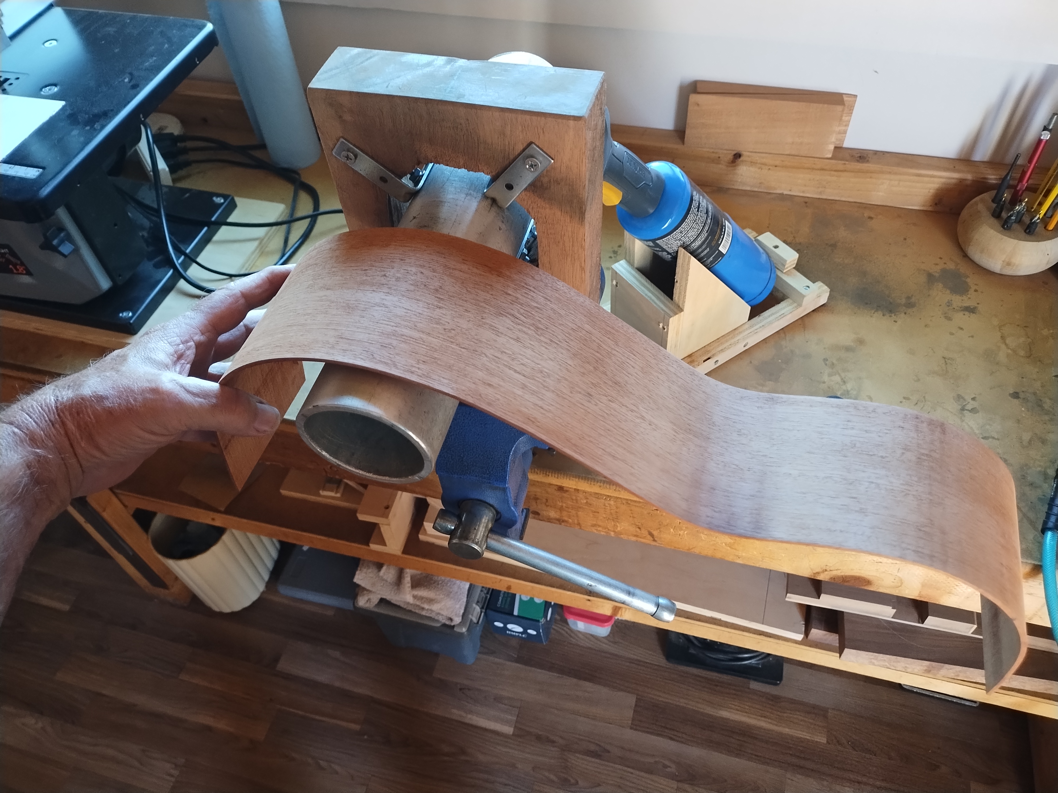 Classical guitar side being steam bent in the workshop