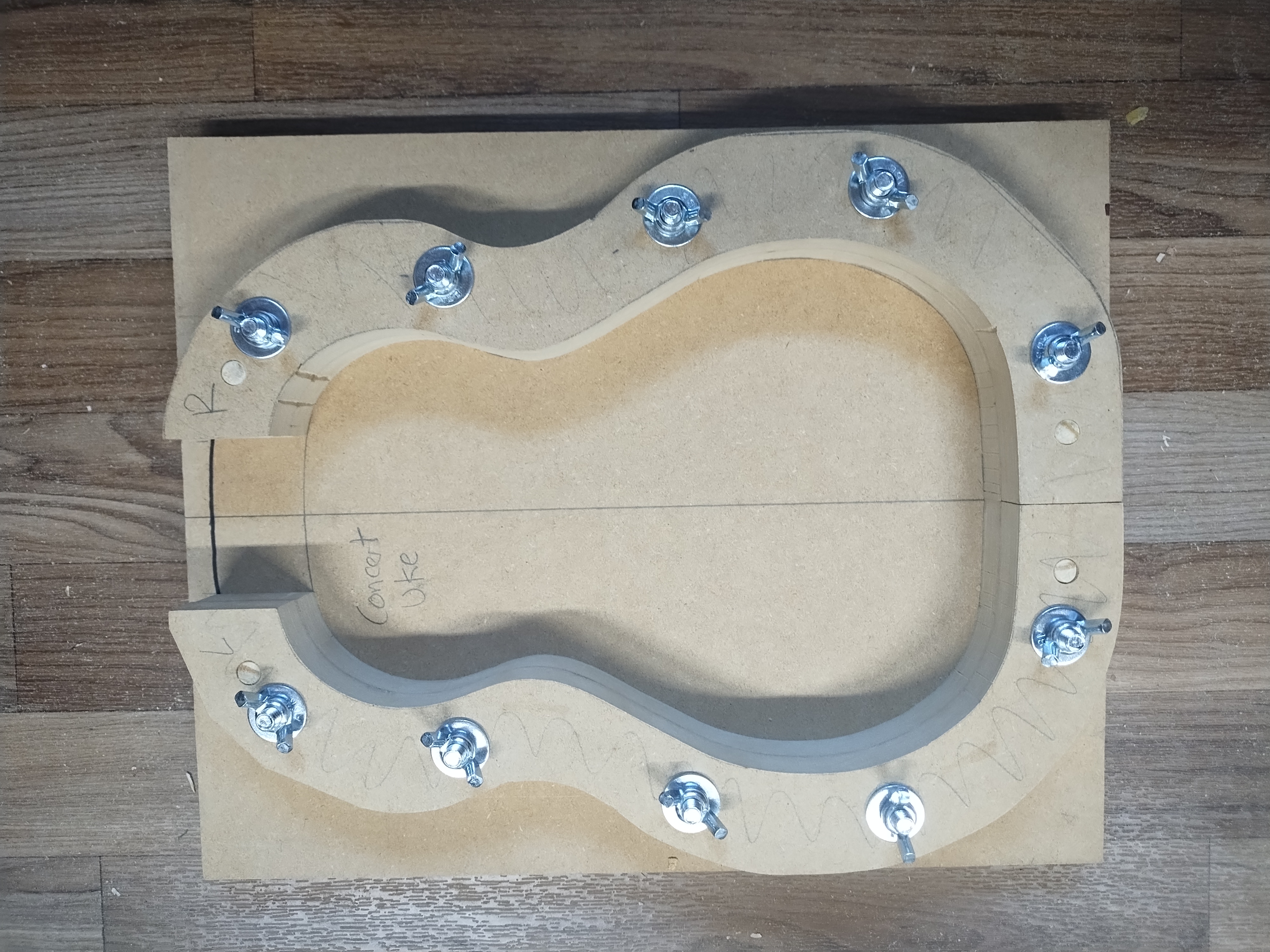 Ukulele solera parts laid out in the workshop