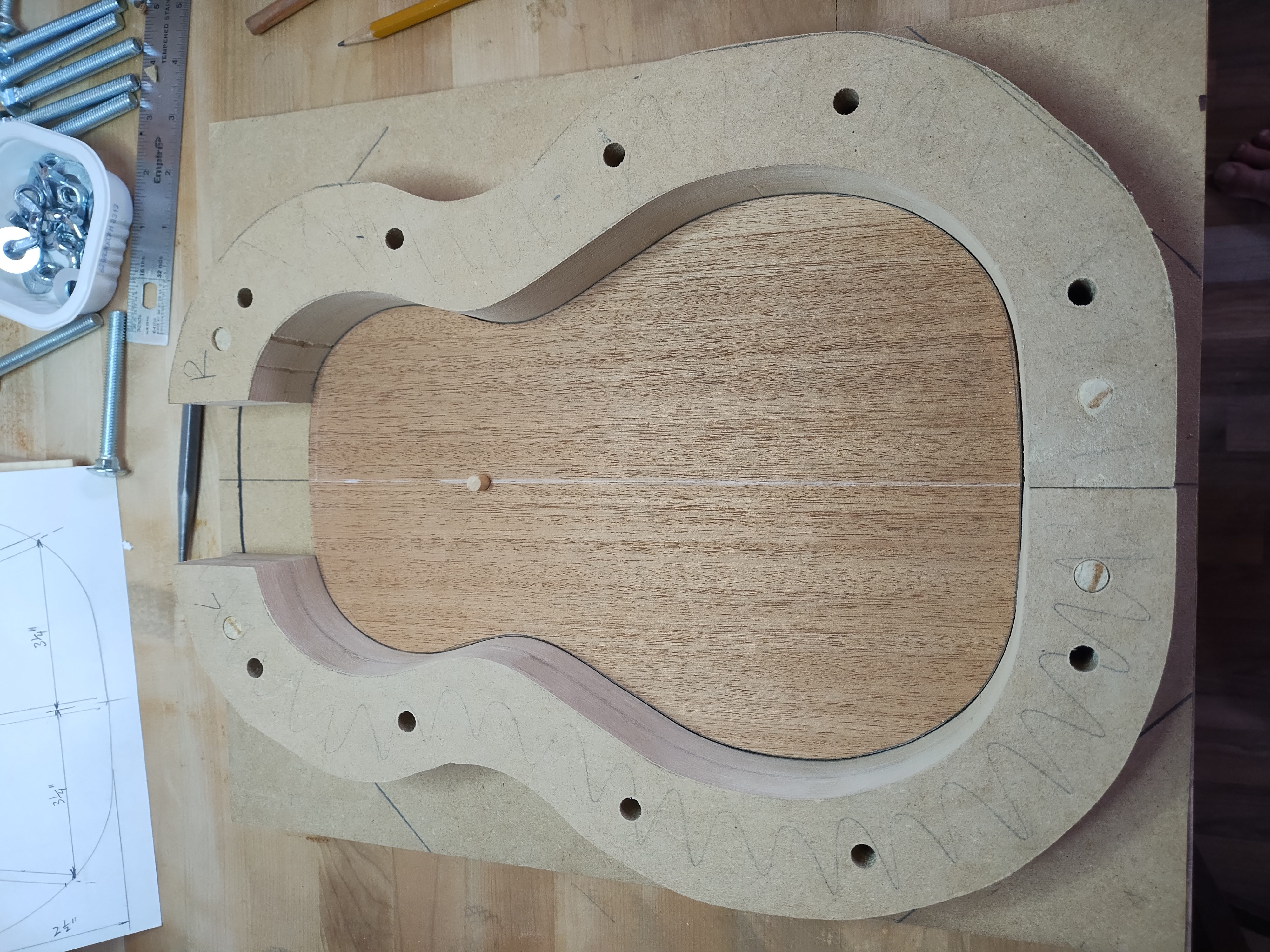 Ukulele soundboard being fitted to the solera