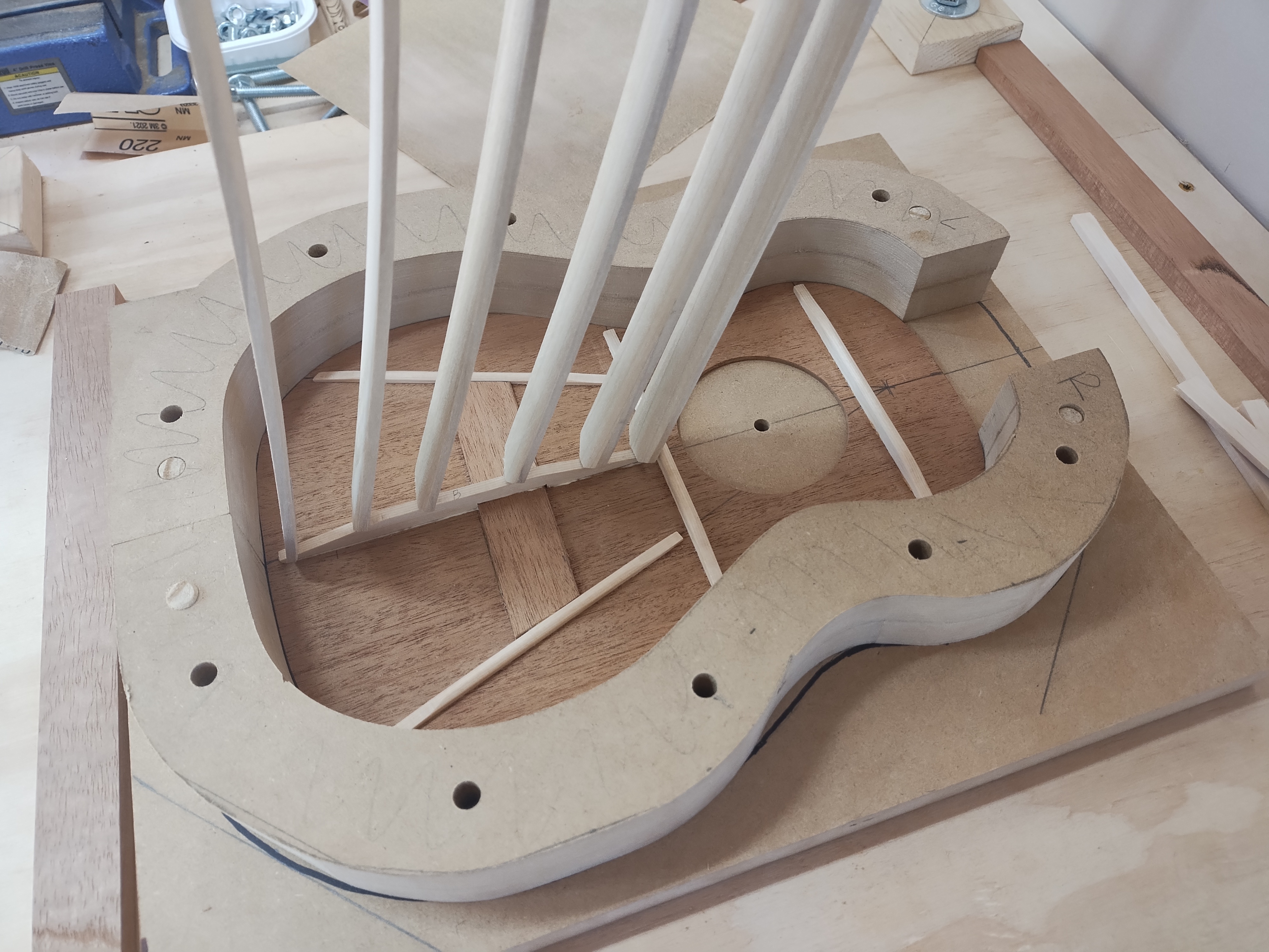 Additional ukulele top bracing being glued in the solera