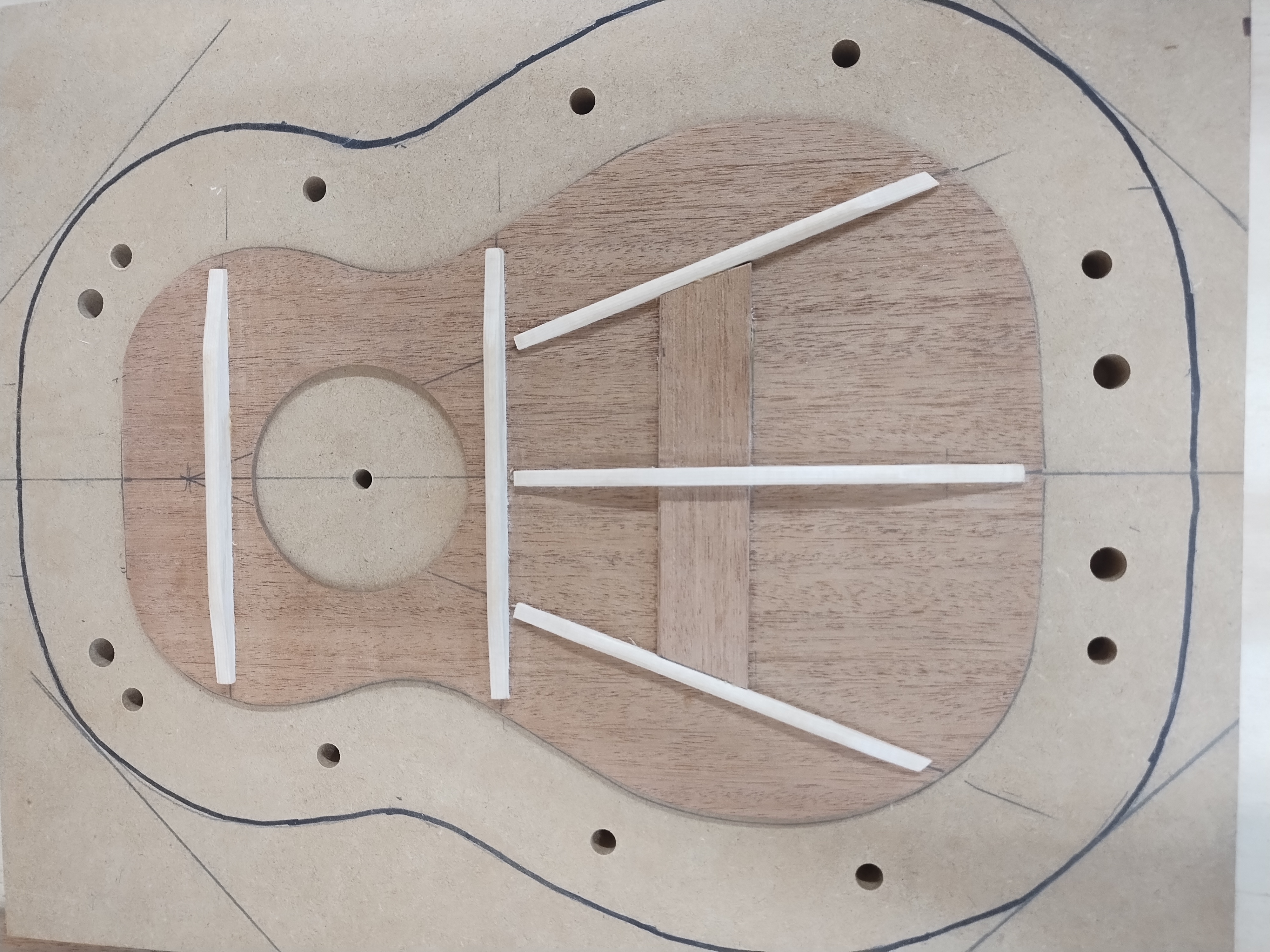 Ukulele top bracing glued and shaped in the solera