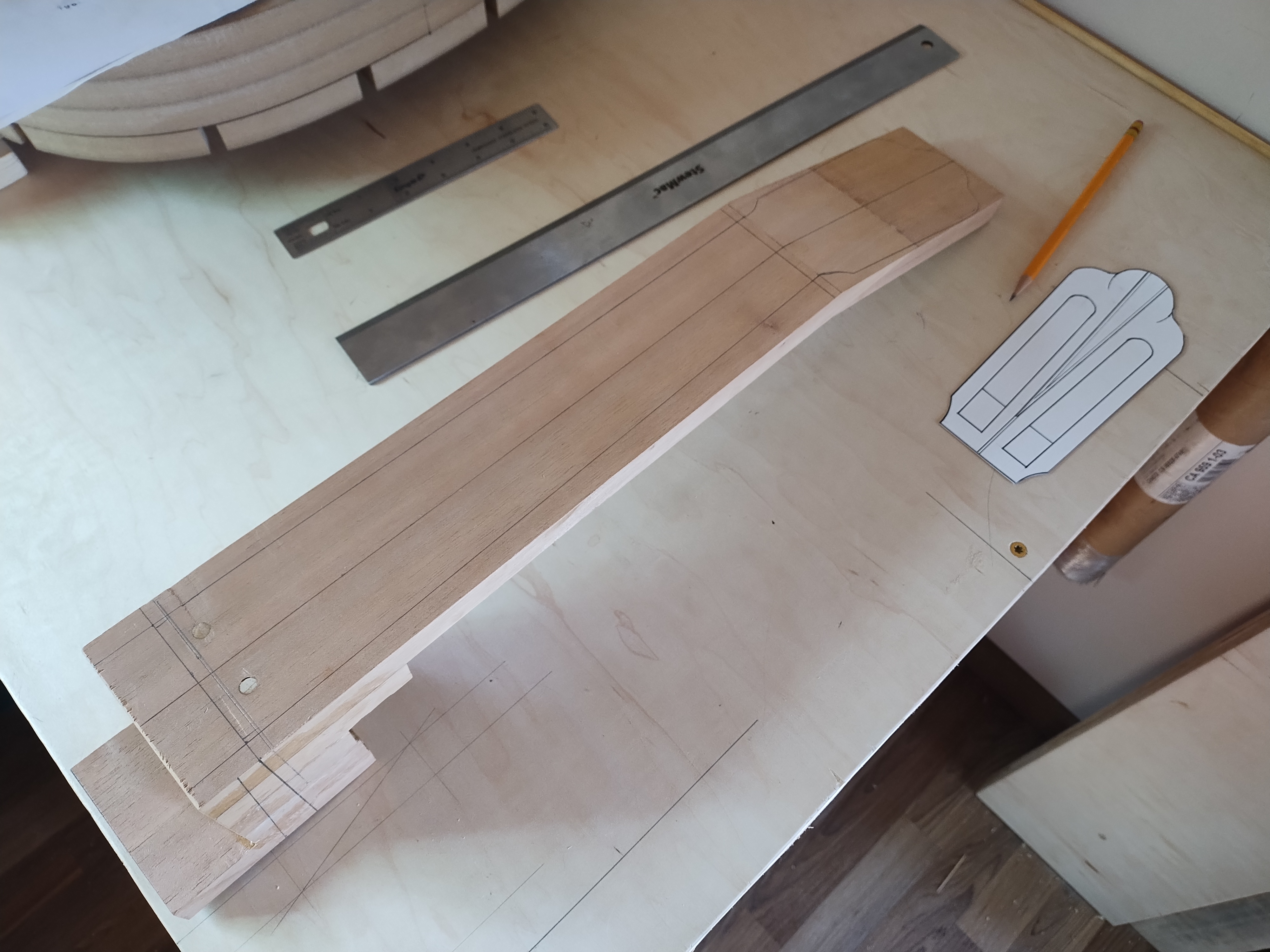 Assembled neck blank laid out on the workshop bench